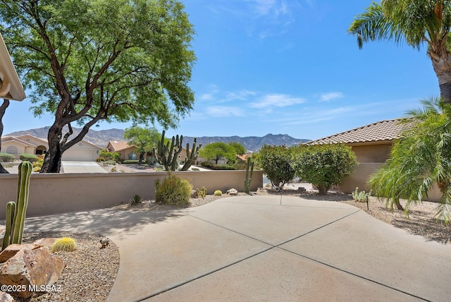 37358 S Ridgeview Blvd, Saddlebrooke, AZ 85739 - view of patio / terrace with a mountain view