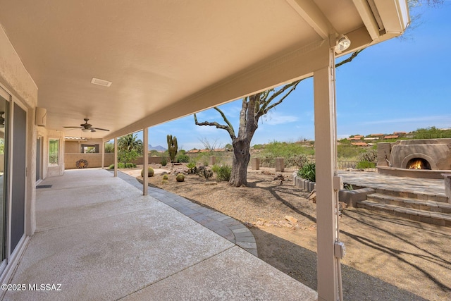 37358 S Ridgeview Blvd, Saddlebrooke, AZ 85739 - fenced backyard featuring a patio and a ceiling fan