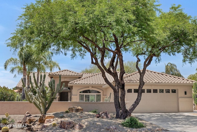 37358 S Ridgeview Blvd, Saddlebrooke, AZ 85739 - mediterranean / spanish house with stucco siding, a tile roof, a garage, and concrete driveway