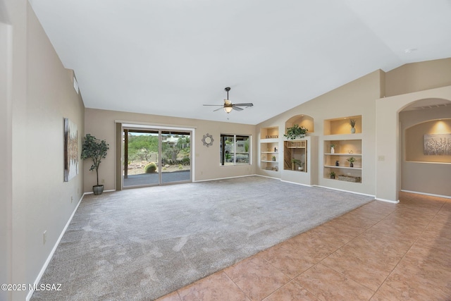 37358 S Ridgeview Blvd, Saddlebrooke, AZ 85739 - unfurnished living room featuring built in features, a ceiling fan, baseboards, light colored carpet, and light tile patterned floors