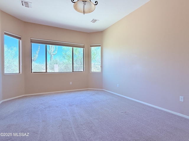 1320 W Bloomington Pl, Tucson, AZ 85755 - carpeted spare room featuring baseboards