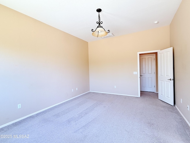 1320 W Bloomington Pl, Tucson, AZ 85755 - spare room featuring light colored carpet and baseboards