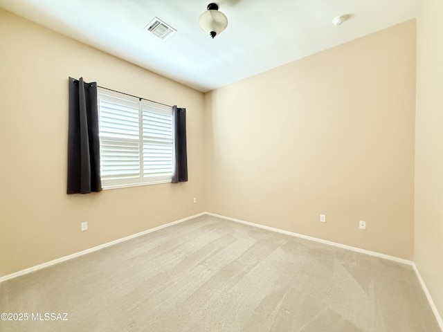 1320 W Bloomington Pl, Tucson, AZ 85755 - carpeted empty room with baseboards and a smoke detector