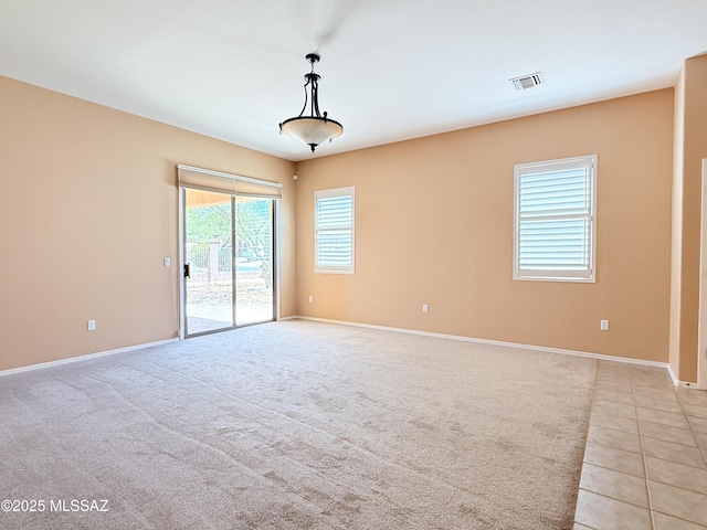 1320 W Bloomington Pl, Tucson, AZ 85755 - empty room featuring baseboards, light colored carpet, and light tile patterned floors