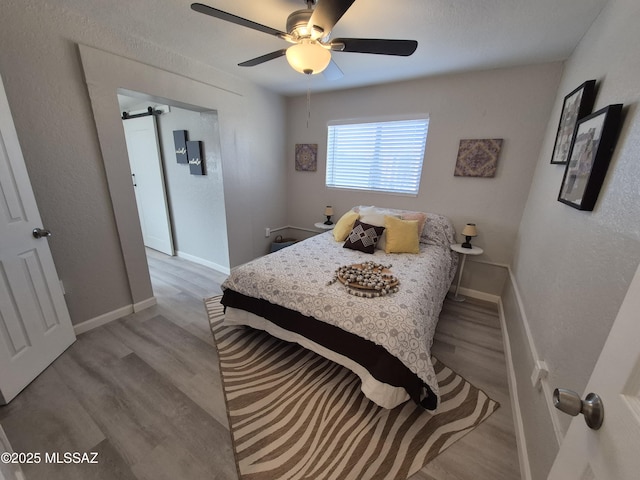 230 N Biddle Ave, Willcox, AZ 85643 - bedroom featuring wood finished floors, baseboards, and a ceiling fan