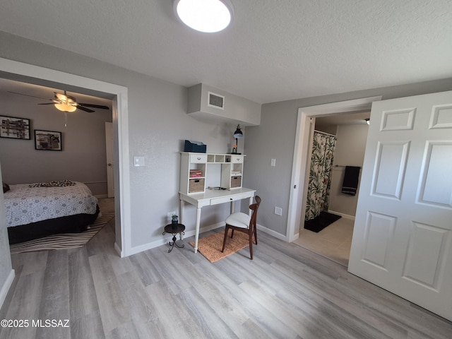 230 N Biddle Ave, Willcox, AZ 85643 - office area featuring a textured ceiling, light wood-style flooring, baseboards, and ceiling fan