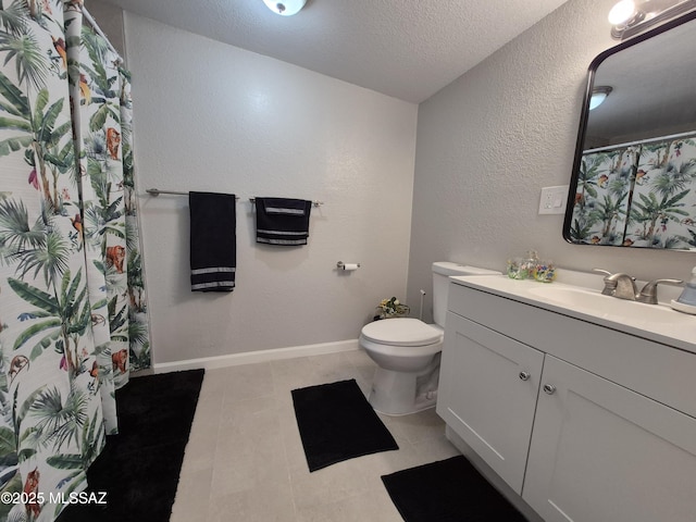 230 N Biddle Ave, Willcox, AZ 85643 - bathroom with vanity, toilet, a textured ceiling, a textured wall, and baseboards