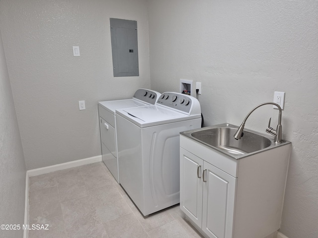 230 N Biddle Ave, Willcox, AZ 85643 - laundry area with electric panel, independent washer and dryer, light tile patterned flooring, cabinet space, and a textured wall