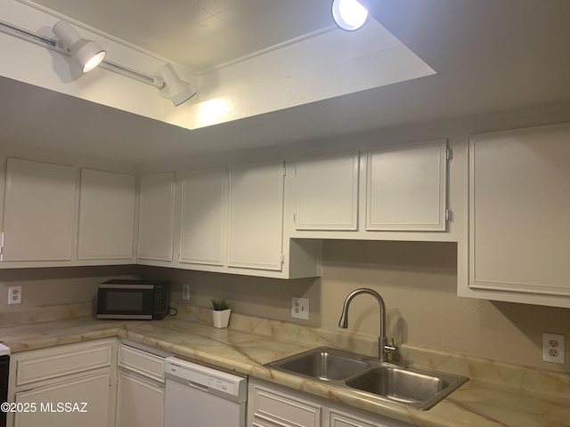 8271 N Oracle Rd Unit 146, Tucson, AZ 85704 - kitchen with white dishwasher, stainless steel microwave, light countertops, and white cabinetry