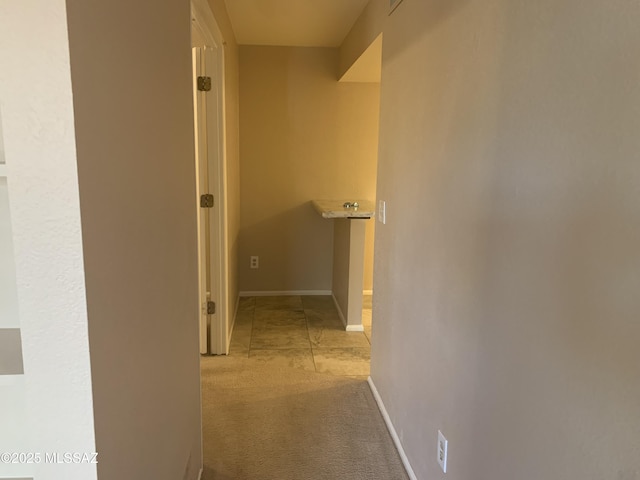 8271 N Oracle Rd Unit 146, Tucson, AZ 85704 - hallway featuring baseboards and light colored carpet