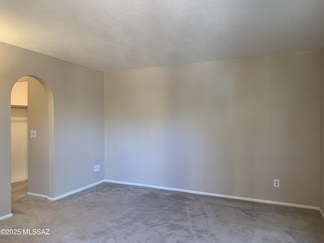 8271 N Oracle Rd Unit 146, Tucson, AZ 85704 - carpeted spare room with arched walkways and baseboards