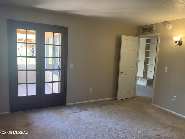 8271 N Oracle Rd Unit 146, Tucson, AZ 85704 - doorway to outside featuring french doors, carpet, and plenty of natural light