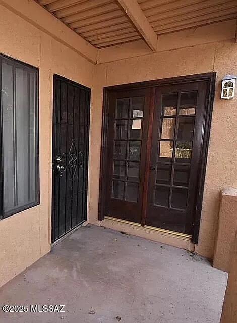 8271 N Oracle Rd Unit 146, Tucson, AZ 85704 - view of exterior entry featuring stucco siding and french doors