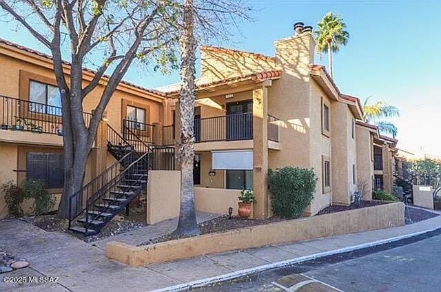 8271 N Oracle Rd Unit 146, Tucson, AZ 85704 - view of building exterior with stairway