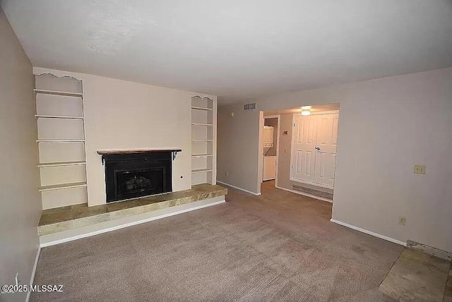 8271 N Oracle Rd Unit 146, Tucson, AZ 85704 - unfurnished living room featuring a fireplace with raised hearth and carpet flooring