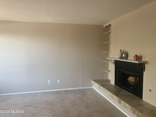 8271 N Oracle Rd Unit 146, Tucson, AZ 85704 - unfurnished living room with a fireplace with raised hearth and carpet floors