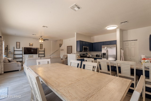 13218 E Mineta Ridge Dr, Vail, AZ 85641 - dining space with a ceiling fan and light wood finished floors