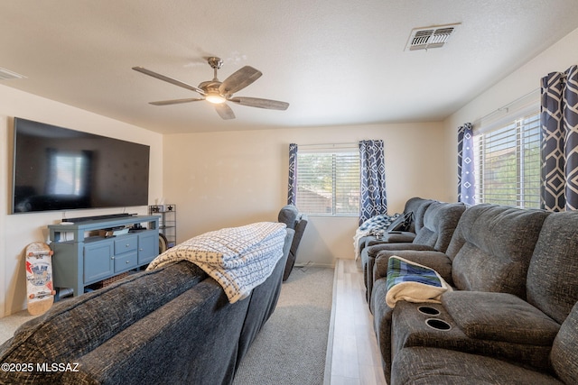 13218 E Mineta Ridge Dr, Vail, AZ 85641 - living area featuring a ceiling fan and wood finished floors