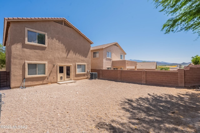 13218 E Mineta Ridge Dr, Vail, AZ 85641 - back of house with stucco siding, a fenced backyard, and a mountain view