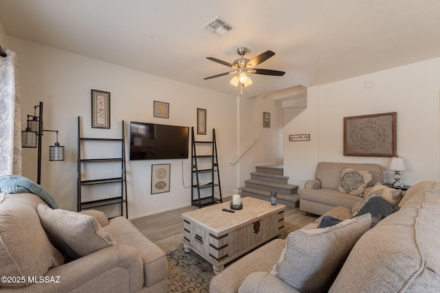 13218 E Mineta Ridge Dr, Vail, AZ 85641 - living room featuring a ceiling fan, wood finished floors, and stairway