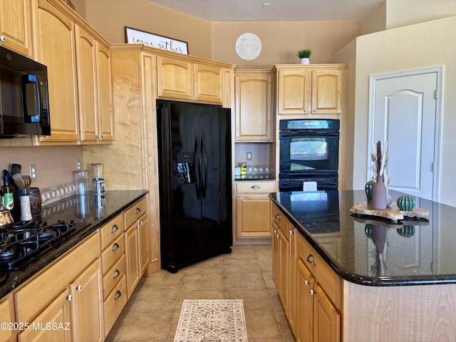 16567 S Saguaro View Ln, Vail, AZ 85641 - kitchen featuring black appliances, light brown cabinetry, dark stone countertops, a center island, and light tile patterned floors