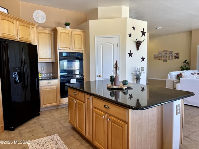 16567 S Saguaro View Ln, Vail, AZ 85641 - kitchen featuring black appliances, dark stone countertops, light tile patterned flooring, a kitchen island, and open floor plan