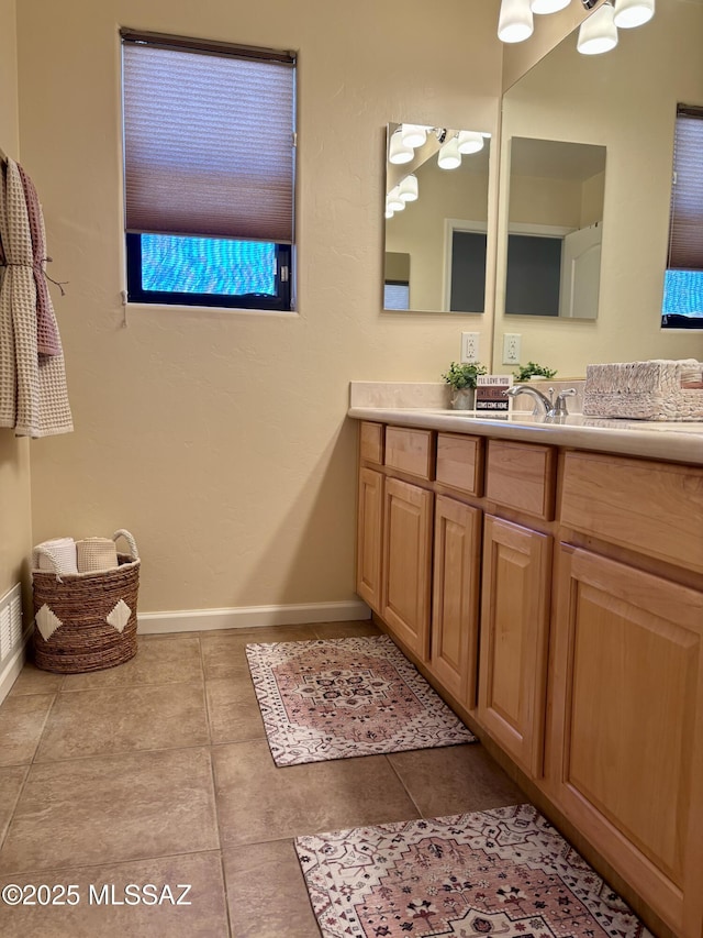 16567 S Saguaro View Ln, Vail, AZ 85641 - bathroom with vanity, baseboards, and tile patterned flooring