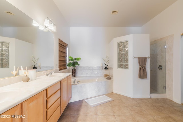 16567 S Saguaro View Ln, Vail, AZ 85641 - bathroom with a garden tub, double vanity, a stall shower, and tile patterned floors