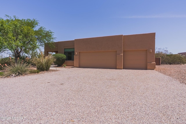 16567 S Saguaro View Ln, Vail, AZ 85641 - pueblo revival-style home featuring driveway, an attached garage, and stucco siding