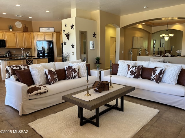 16567 S Saguaro View Ln, Vail, AZ 85641 - tiled living room with arched walkways, recessed lighting, and a chandelier