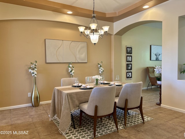 16567 S Saguaro View Ln, Vail, AZ 85641 - dining space featuring arched walkways, a chandelier, tile patterned flooring, recessed lighting, and baseboards