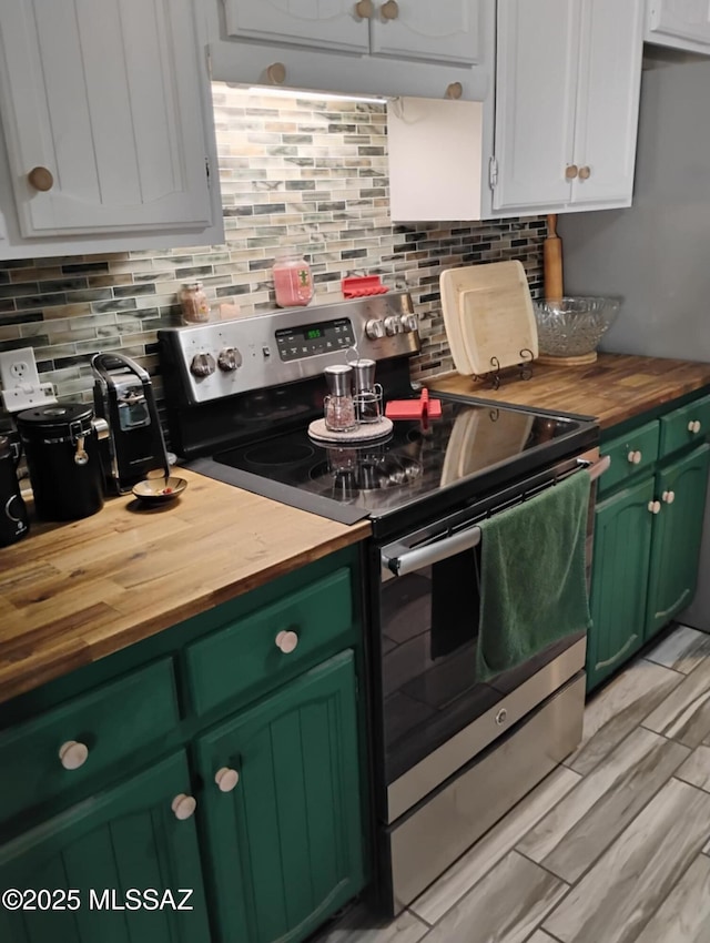 242 N Sage St, Pearce, AZ 85625 - kitchen featuring stainless steel electric range oven, wooden counters, green cabinets, and decorative backsplash