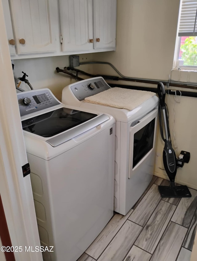 242 N Sage St, Pearce, AZ 85625 - laundry room with washer and clothes dryer, cabinet space, and light wood-style flooring