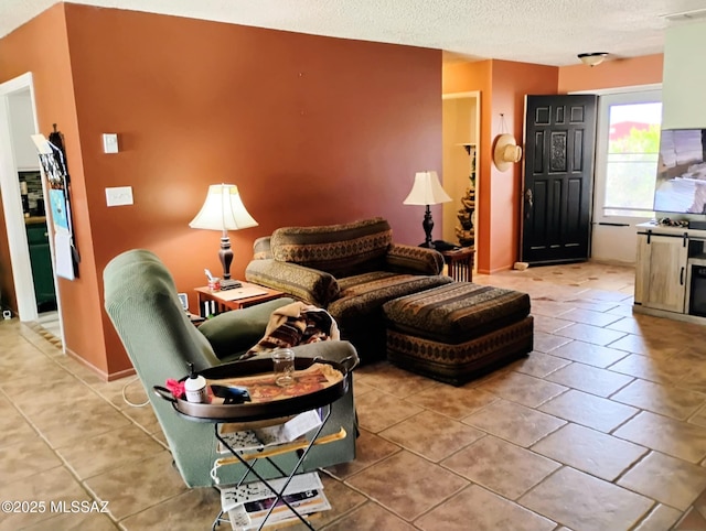 242 N Sage St, Pearce, AZ 85625 - tiled living room with a textured ceiling