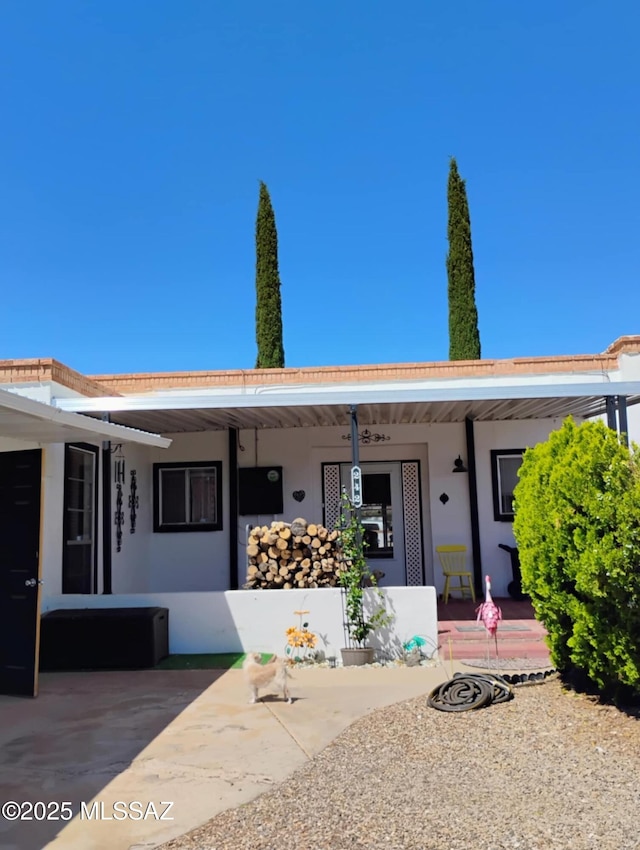 242 N Sage St, Pearce, AZ 85625 - view of front facade with covered porch and stucco siding