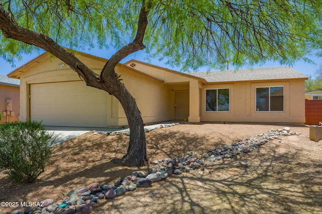 8876 E Apache Well Pl, Tucson, AZ 85730 - ranch-style home featuring an attached garage, stucco siding, and concrete driveway
