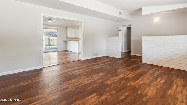 5701 E Waverly St, Tucson, AZ 85712 - spare room with dark wood-type flooring and baseboards