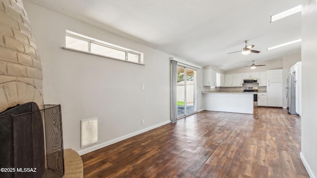 5701 E Waverly St, Tucson, AZ 85712 - unfurnished living room featuring ceiling fan, dark wood finished floors, lofted ceiling, and baseboards