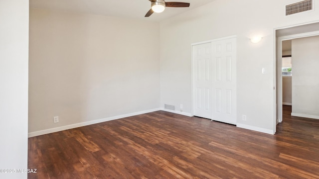 5701 E Waverly St, Tucson, AZ 85712 - unfurnished bedroom featuring wood finished floors, a closet, baseboards, and ceiling fan