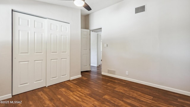 5701 E Waverly St, Tucson, AZ 85712 - unfurnished bedroom with wood finished floors, baseboards, a closet, and ceiling fan