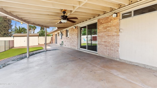 5701 E Waverly St, Tucson, AZ 85712 - fenced backyard featuring a patio area, a ceiling fan, and an outdoor structure