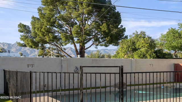 5701 E Waverly St, Tucson, AZ 85712 - gate featuring a mountain view