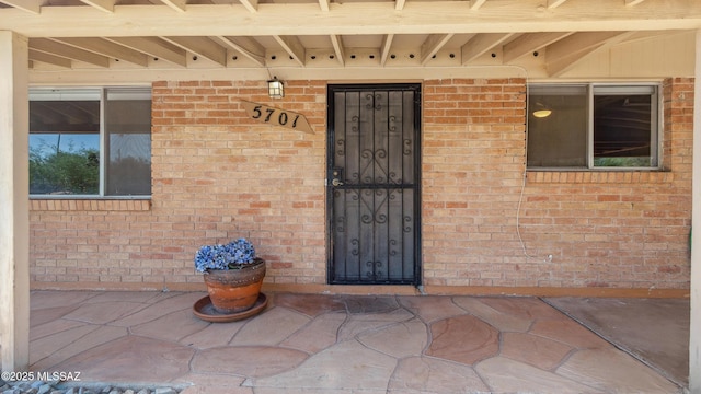5701 E Waverly St, Tucson, AZ 85712 - property entrance with brick siding