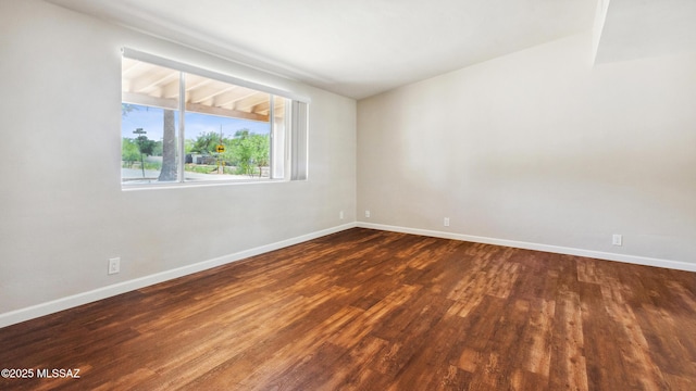 5701 E Waverly St, Tucson, AZ 85712 - empty room with dark wood-type flooring and baseboards
