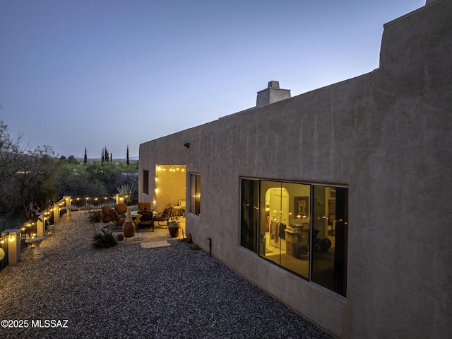 2460 N Cavalry Trl, Tucson, AZ 85749 - rear view of house with a patio, a chimney, and stucco siding