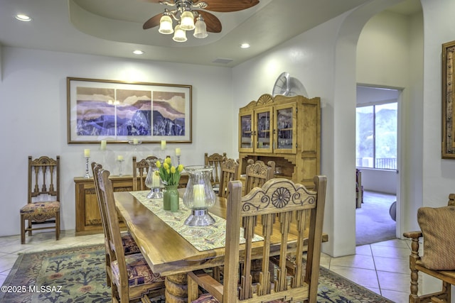 2460 N Cavalry Trl, Tucson, AZ 85749 - dining room with arched walkways, light tile patterned floors, recessed lighting, and a ceiling fan