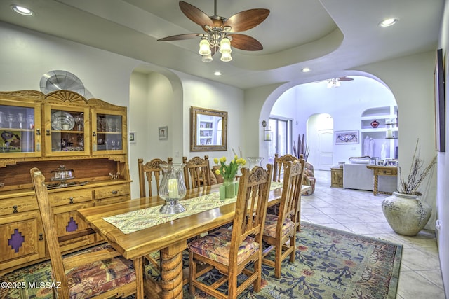 2460 N Cavalry Trl, Tucson, AZ 85749 - dining room featuring arched walkways, ceiling fan, recessed lighting, and light tile patterned flooring