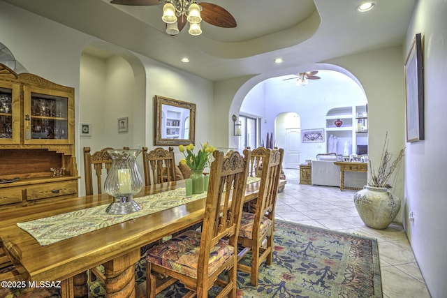 2460 N Cavalry Trl, Tucson, AZ 85749 - dining room with a ceiling fan, arched walkways, recessed lighting, and light tile patterned flooring