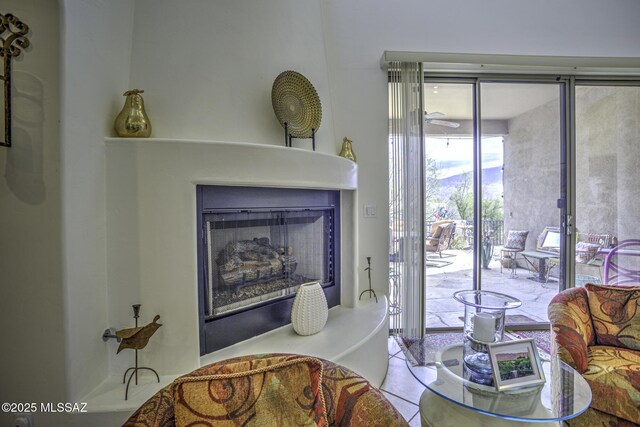 2460 N Cavalry Trl, Tucson, AZ 85749 - living area featuring a fireplace with raised hearth