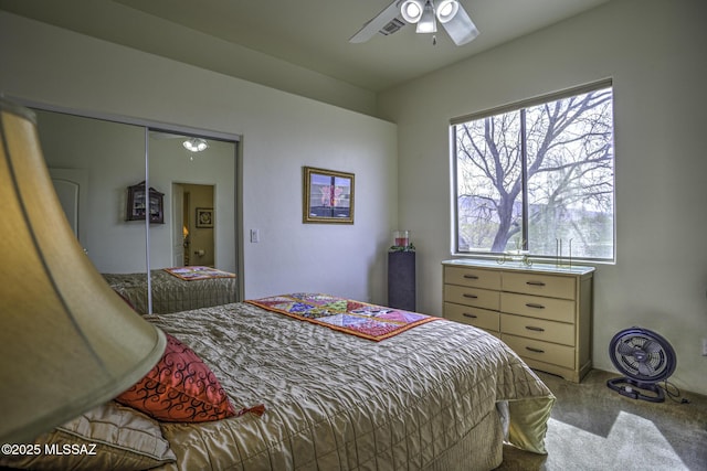 2460 N Cavalry Trl, Tucson, AZ 85749 - bedroom with carpet flooring, multiple windows, a ceiling fan, and a closet
